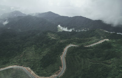 High angle view of road amidst mountains against sky