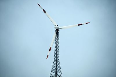 Low angle view of windmill against clear sky