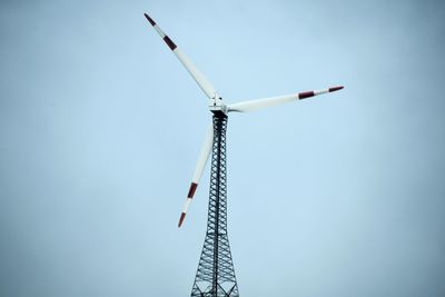 Low angle view of windmill against clear sky