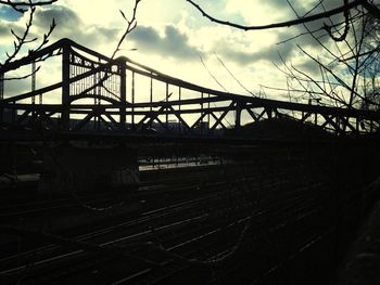 Bridge against cloudy sky