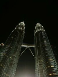 Low angle view of illuminated city at night