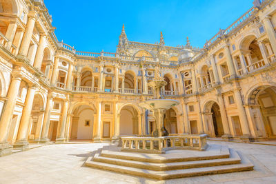 Low angle view of historical building against blue sky