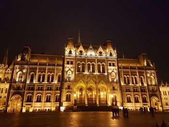 Facade of historical building at night