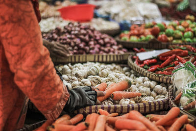Man for sale at market stall