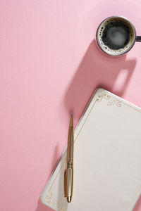 High angle view of clock on table against wall