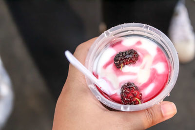 Midsection of person holding ice cream