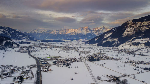 Scenic view of snow covered mountains against sky