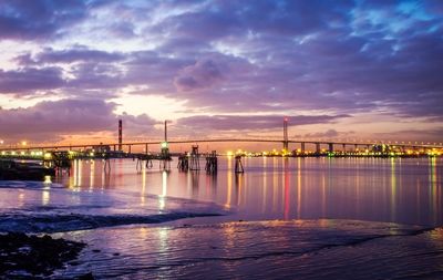 Illuminated bridge over river