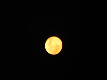 Low angle view of moon against clear sky at night