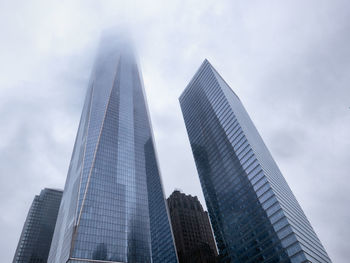 Low angle view of skyscrapers against sky