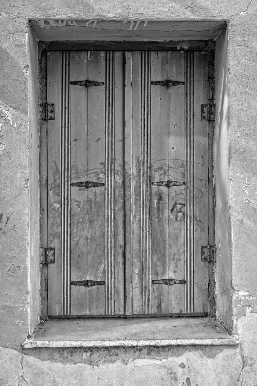 door, building exterior, built structure, closed, architecture, house, window, safety, entrance, protection, wood - material, security, old, residential structure, outdoors, day, weathered, closed door, no people, wooden