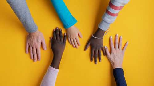 High angle view of people against yellow background