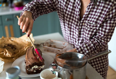 Midsection of woman preparing food