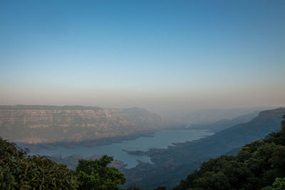 Scenic view of mountains against clear blue sky