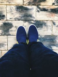 Low section of man standing on floor