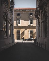 Side view of man walking on city street