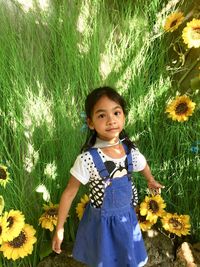 Portrait of happy girl on field