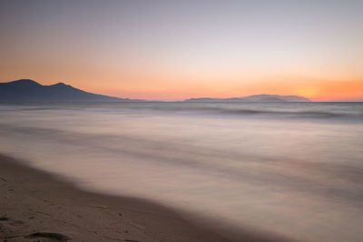 Scenic view of sea at sunset