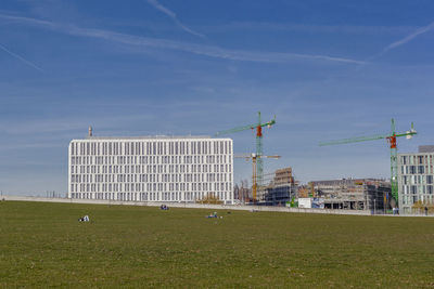 Built structure on field against cloudy sky