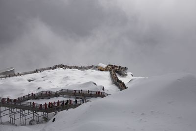 Scenic view of snow covered mountain against sky