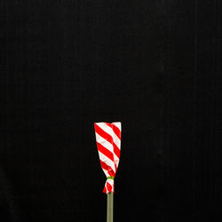 Low angle view of flag against black background