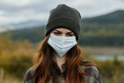 Portrait of beautiful young woman outdoors