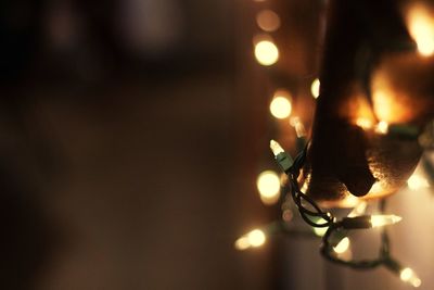 Close-up of illuminated christmas lights at home