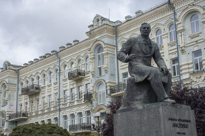 Low angle view of statue against sky