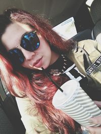 Close-up portrait of smiling young woman