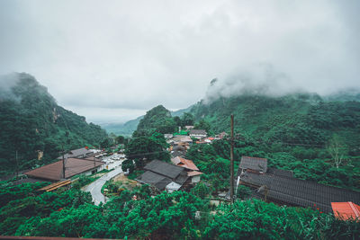 Panoramic view of building and mountains against sky