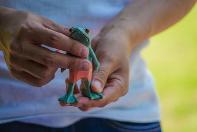 Close-up of man holding toy