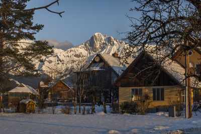 Scenic view of snow covered mountains against sky