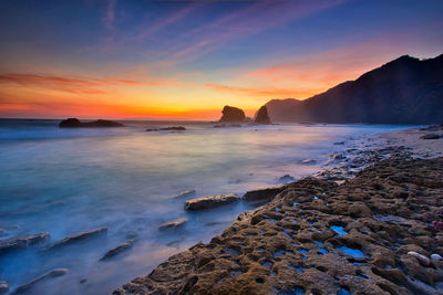 Scenic view of sea against sky during sunset