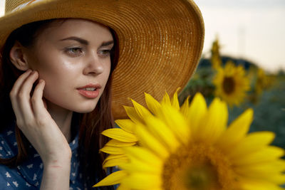 Close-up of young woman wearing hat