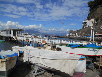 Boats moored at harbor