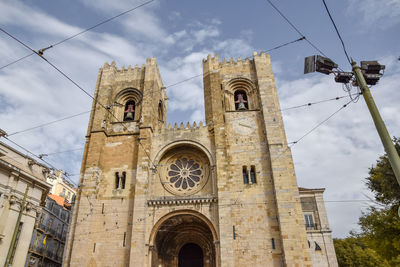 Lisbon cathedral, in the tourist district of alfama, on a sunny summer day.