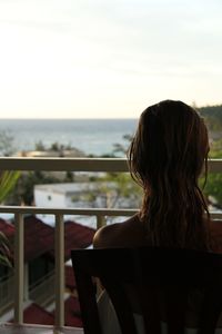 Rear view of woman looking at sea