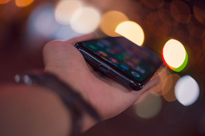 Close-up of hand holding smart phone