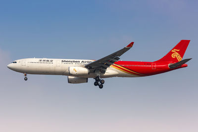 Low angle view of airplane against clear sky