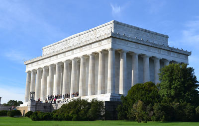 Low angle view of historical building against cloudy sky