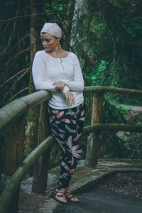 Woman looking at camera in forest