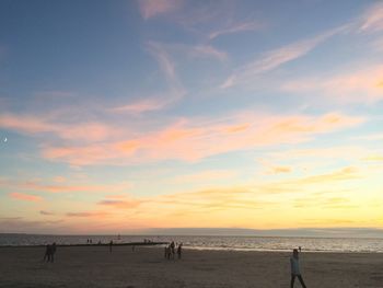 Scenic view of beach against sky during sunset