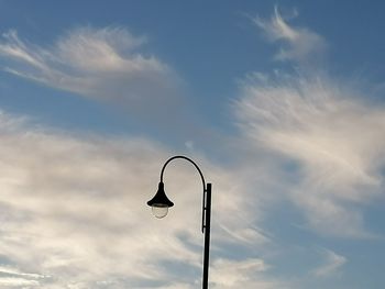 Low angle view of street light against sky