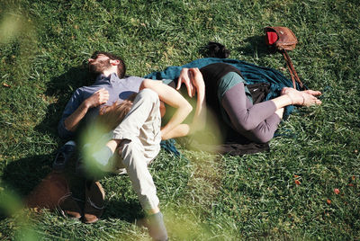 Young couple lying on grass