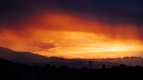 Scenic view of dramatic sky during sunset