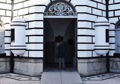 Woman standing in front of building