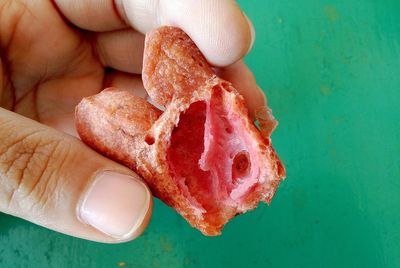 Close-up of hand holding bread