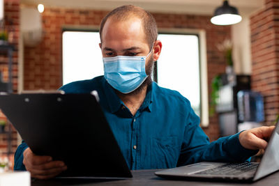 Man using laptop at table