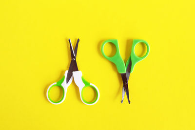 Directly above shot of yellow representation against blue background