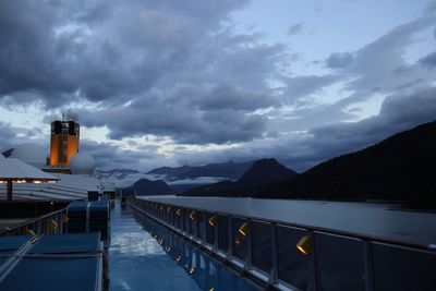 Scenic view of lake against sky at dusk